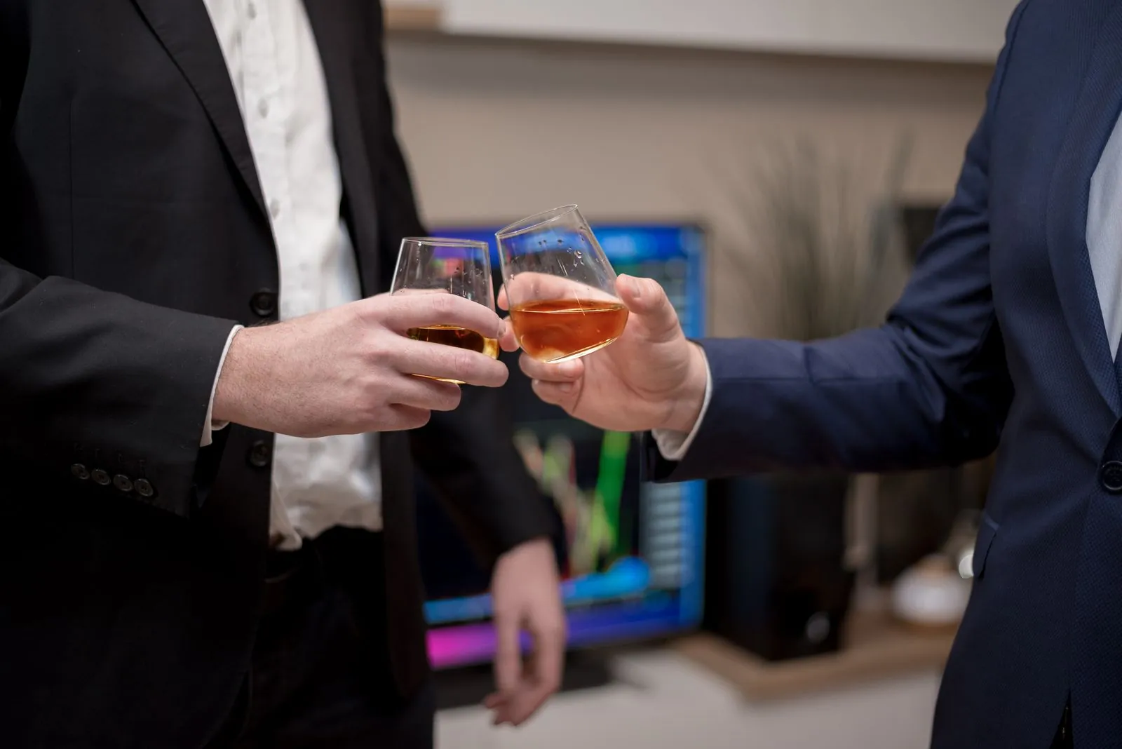 Businessmen raising glasses after a meeting