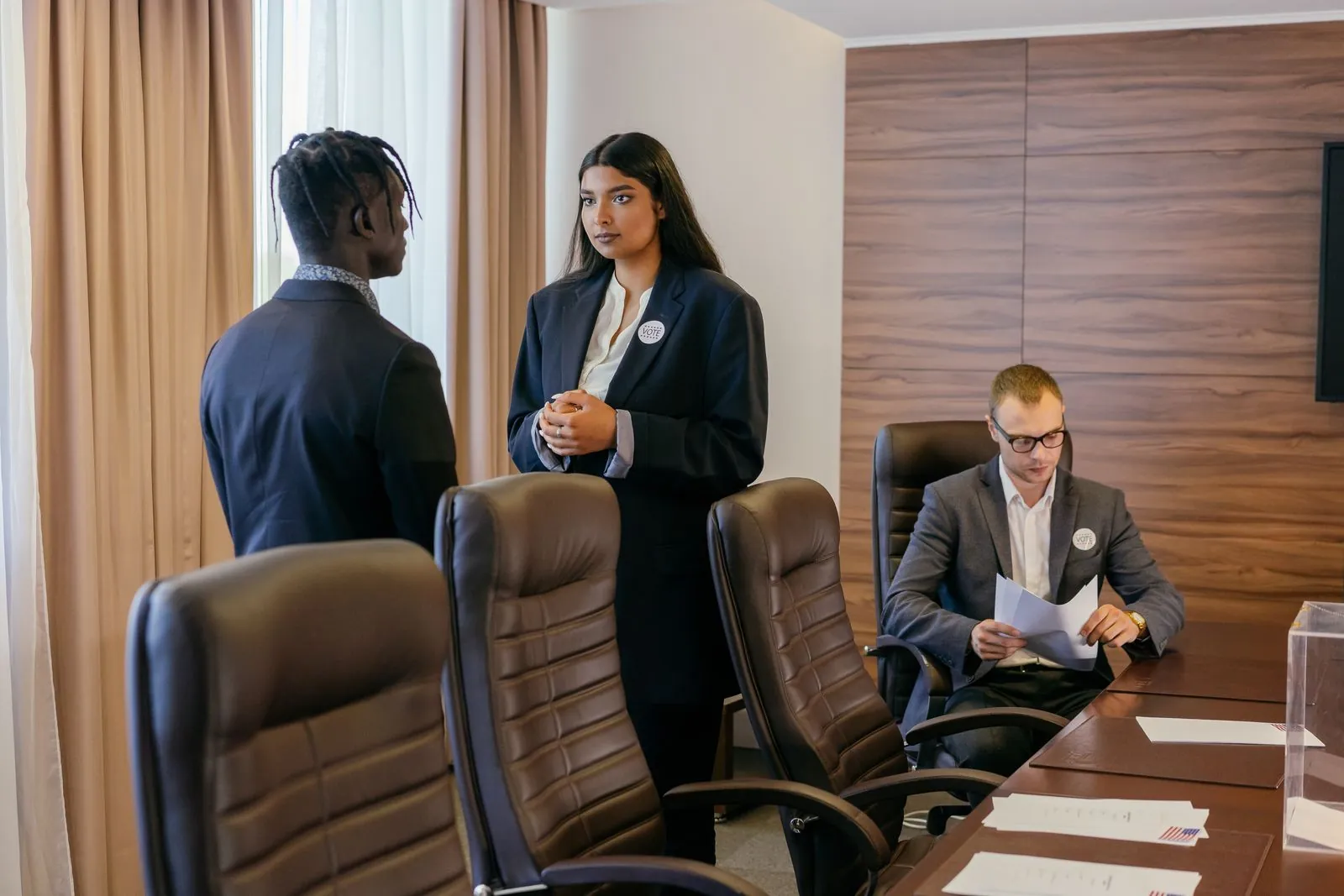 Executives meeting in a wood-panelled boardroom
