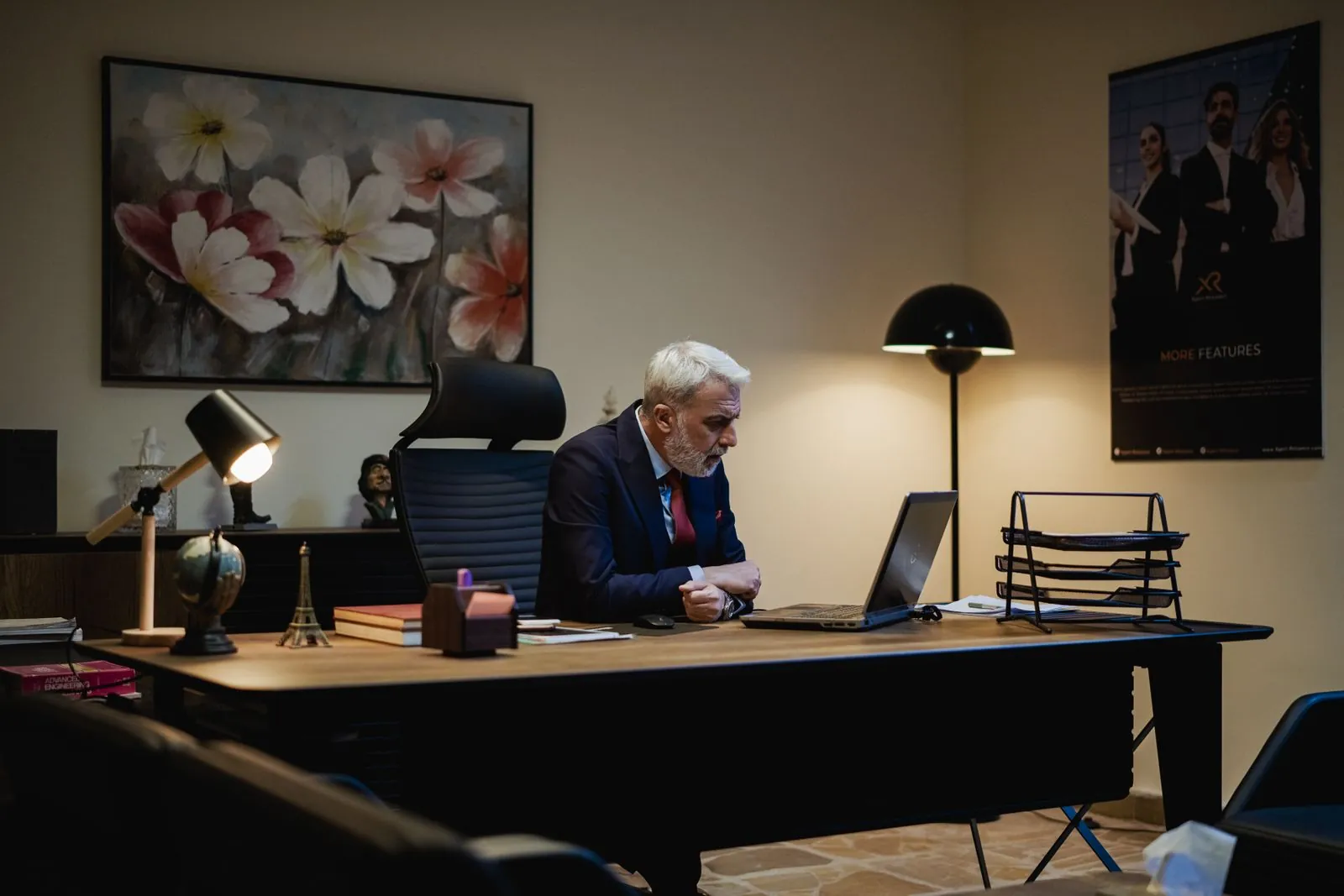 Senior business owner working at his office desk